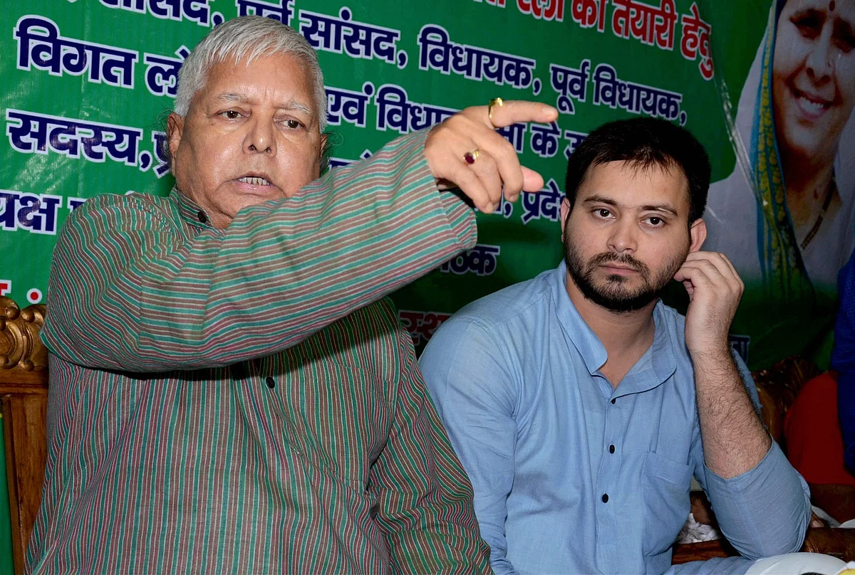 RJD supremo Lalu Yadav with his son Tejashwi Yadav. 