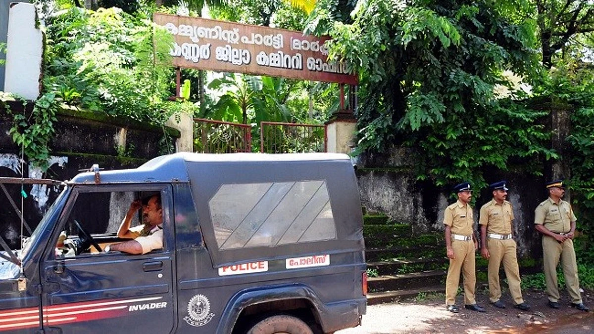 Police security outside CPI (M) office in Kannur in view of the multiple attacks in the capital city.