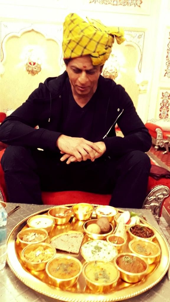 

Shah Rukh Khan tastes dal baati churma for the first time.