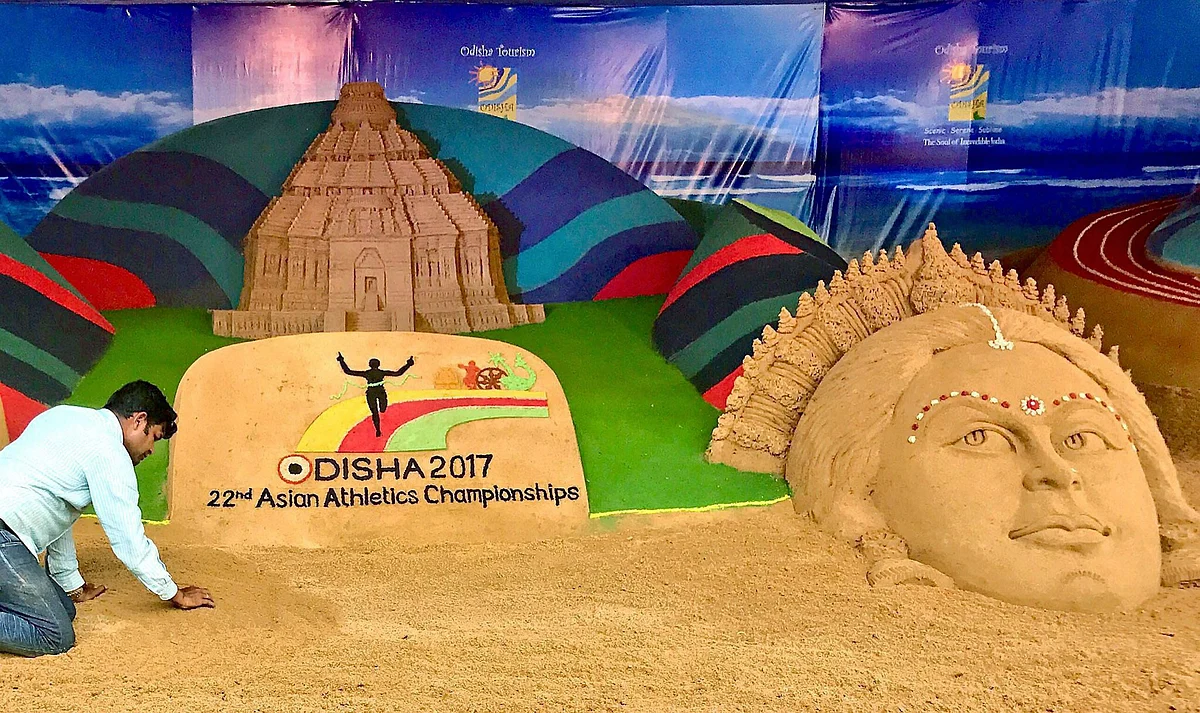 Sand artist Sudarsan Pattnaik creates a sand sculpture at 22nd Asian Athletics Championships in Kalinga Stadium in Bhubaneswar on Wednesday. 