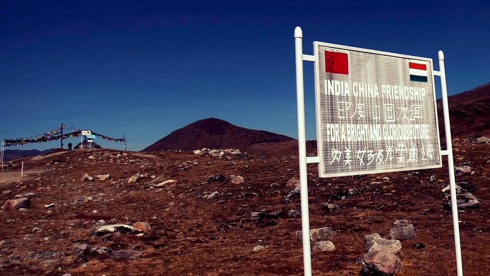 A signboard seen from the Indian side of the India-China border.