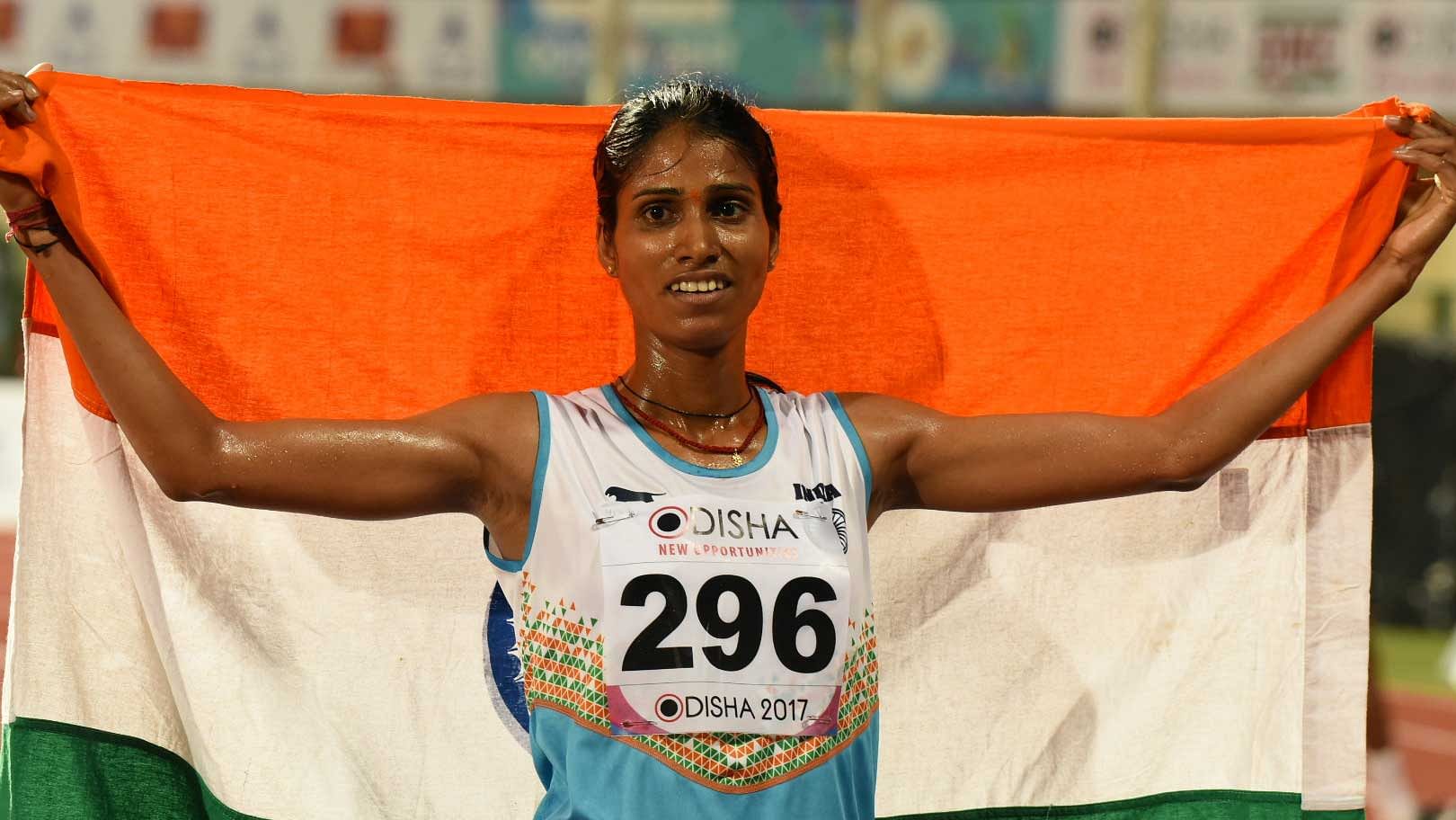 Sudha Singh celebrates after winning gold in the women’s 3,000 metre steeplechase event during Asian Athletics Championship at Kalinga Stadium in Bhubaneswar on 8 July 2017.&nbsp;
