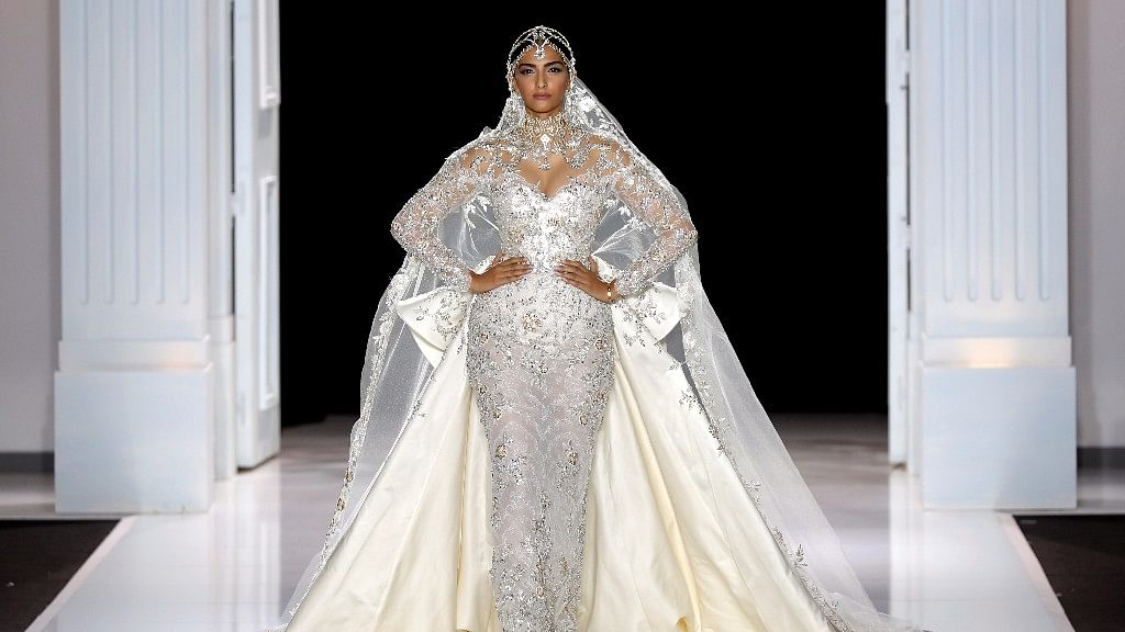 Sonam Kapoor presents a wedding dress by Australian designers Tamara Ralph and Michael Russo as part of their Haute Couture Fall/Winter 2017/2018 collection show for Ralph &amp; Russo in Paris, France, 3 July 2017. (Photo: Reuters)