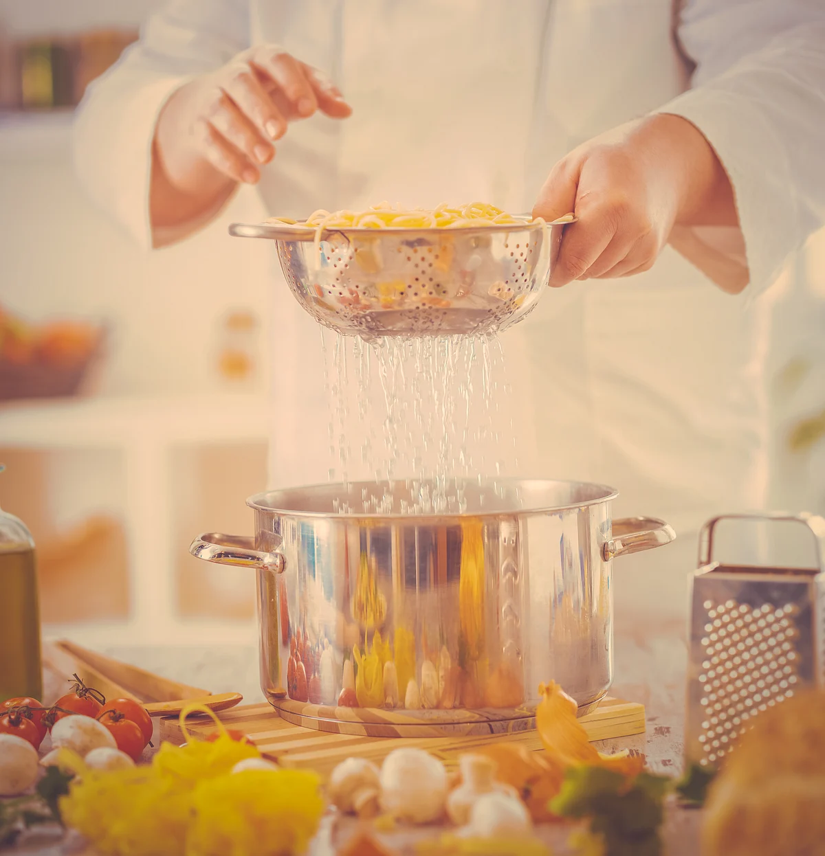 Once your pasta’s boiled, strain it in a colander and place it over a pot so that the pasta water is saved.