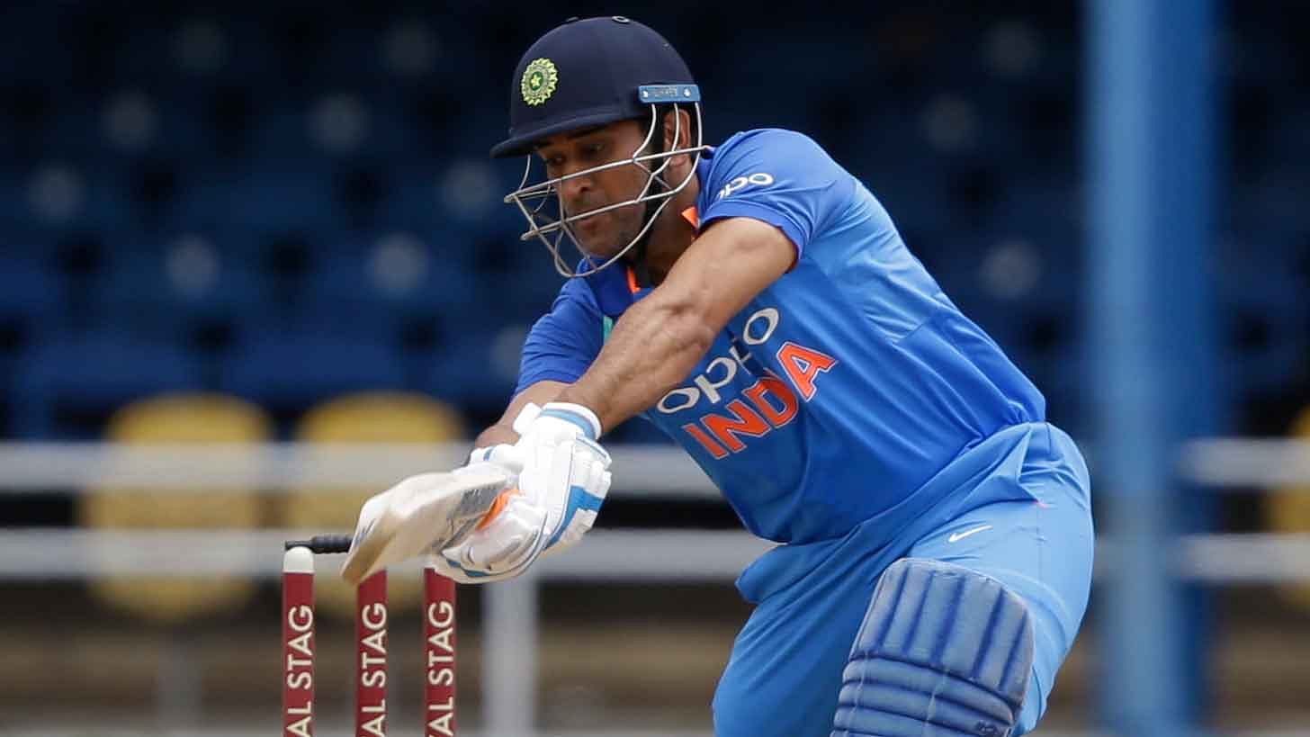 MS Dhoni plays a shot during the third ODI against West Indies at North Sound on Friday.