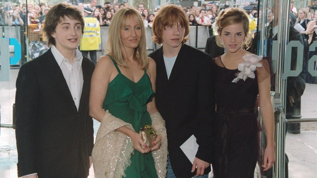An old photo of the main cast of the Harry Potter movies and author JK Rowling. 