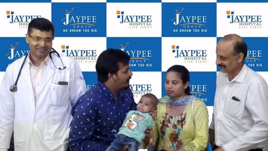 Baby Rohaan with his parents and doctors at the Noida hospital.