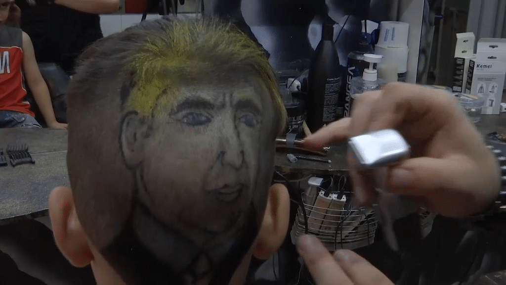 Trump’s image shaved on a boys head