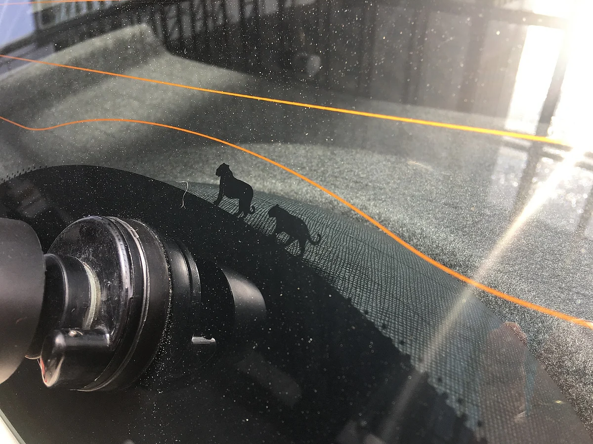 A pair of tigresses embossed on the rear windshield are some of the fun elements in the design of the Tata Nexon. 