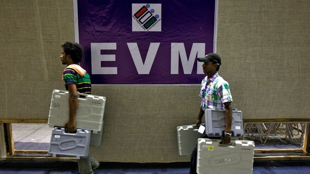 Election staff carry electronic voting machines (EVM) after collecting them from a distribution centre. Image used for representational purposes.