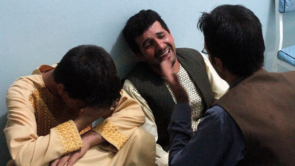 Relatives mourn after a suicide attack on a mosque in Heart, Afghanistan on Tuesday.
