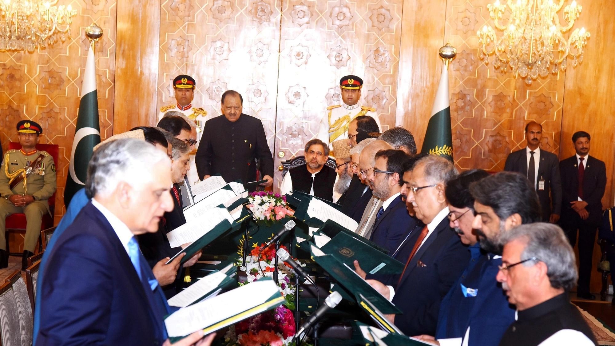 Photo released by Pakistan’s Press Information Department (PID) on Aug. 4, 2017 shows federal ministers of Pakistan’s new cabinet being sworn in by Pakistani President Mamnoon Hussain during a sworn-in ceremony at President House in Islamabad, capital of Pakistan. Pakistan’s new cabinet of Prime Minister Shahid Khaqan Abbasi was sworn in at an oath-taking ceremony at the Presidency in Islamabad on Friday.&nbsp;
