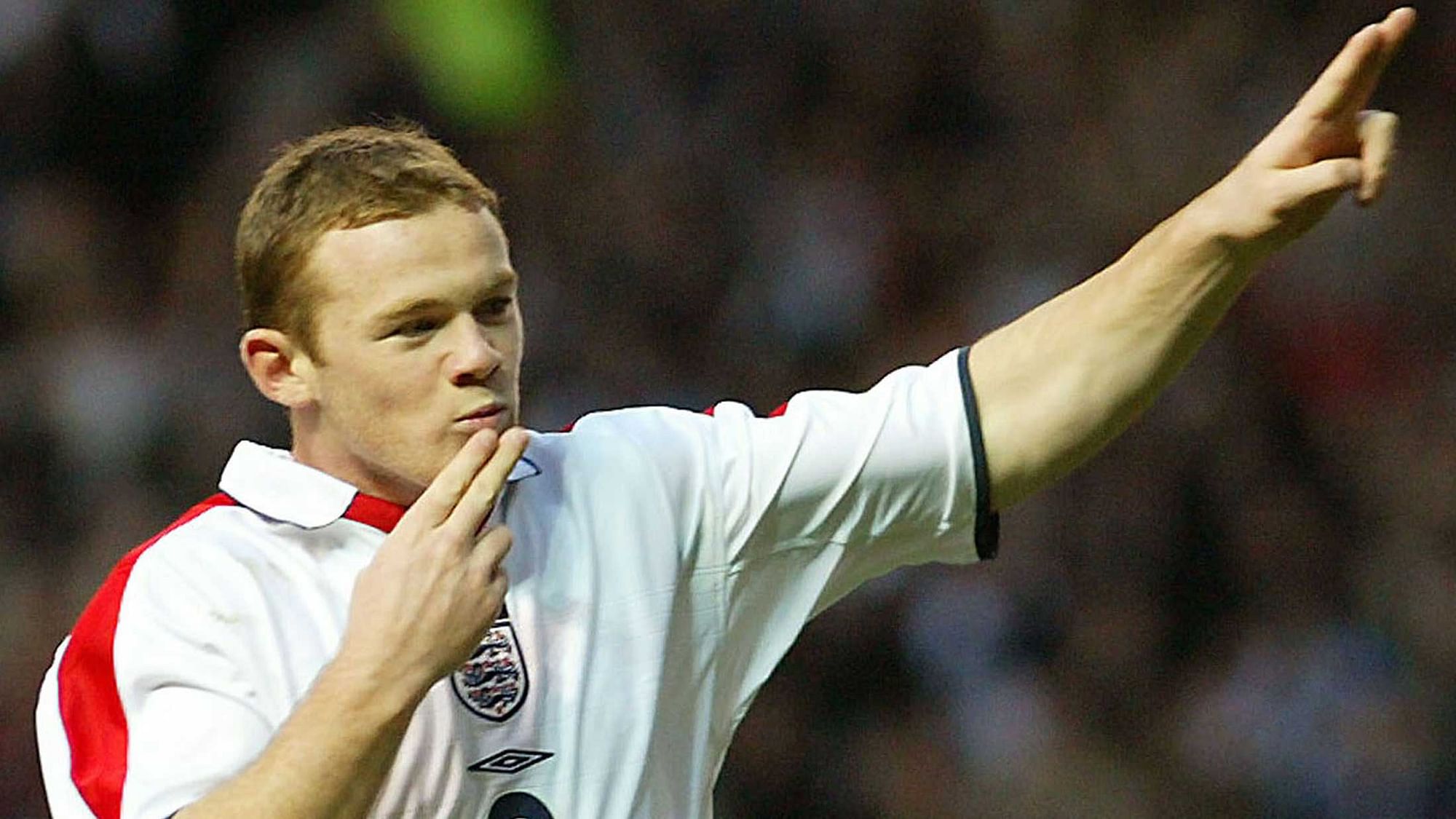 16 November, 2013 | File photo of a young Wayne Rooney celebrating his goal against Denmark in an international friendly match at Old Trafford, Manchester