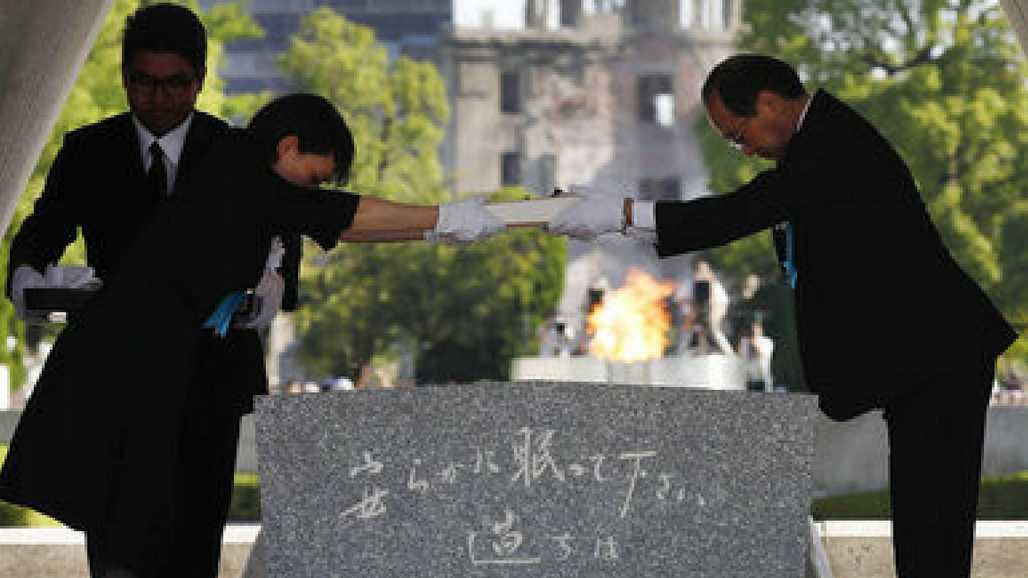  Hiroshima Mayor Kazumi Matsui, right, hands over the name list of newly-added people who died of the world’s first atomic bombing over the past year during a ceremony to mark the 72nd anniversary of the 1945 bombing.&nbsp;