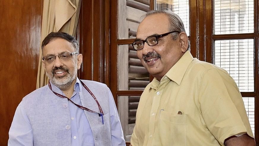 Former Home Secretary Rajiv Mehrishi (right) with the new Home Secretary, Rajiv Gauba, in New Delhi.