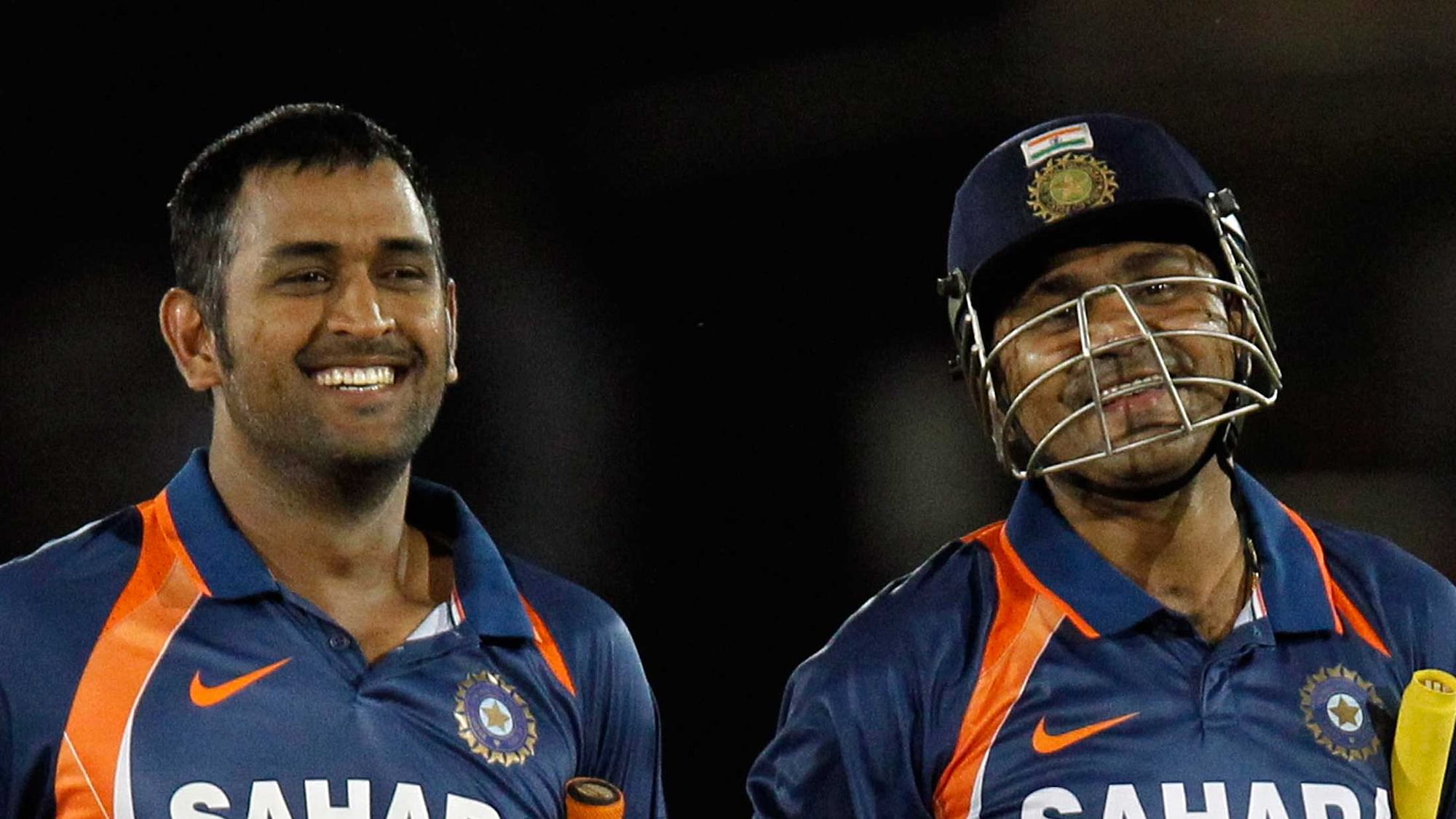 Virender Sehwag and captain Mahendra Singh Dhoni during a match for India in 2010.