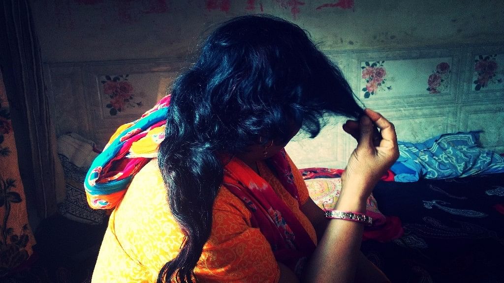 A <i>‘choti cutting’</i> victim shows her hair that was cut mysteriously on Wednesday night.