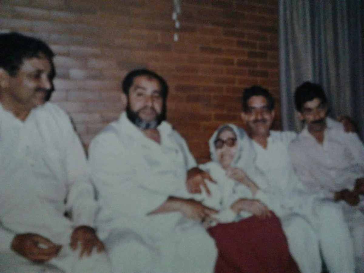 The four Khawaja brothers sitting with their mother. Sitting on the extreme left is Khawaja Riaz, and next to him is Khawaja Mushtaque. 