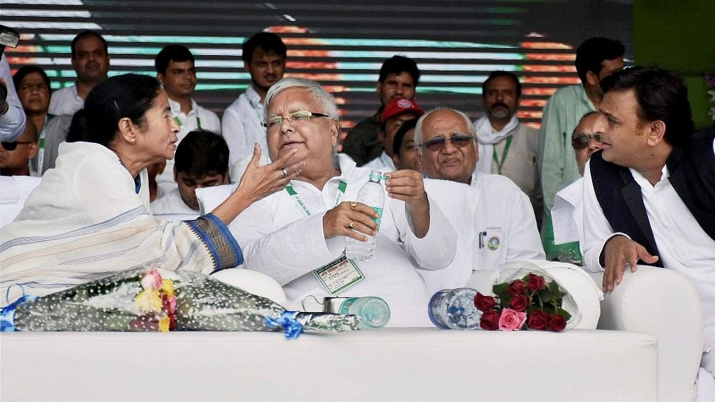 Rashtriya Janata Dal (RJD) chief Lalu Prasad with Trinamool Congress supremo and West Bengal Chief Minister Mamata Banerjee, and former Uttar Pradesh Chief Minister Akhilesh Yadav at the ‘BJP Bhagao, Desh Bachao’ rally.