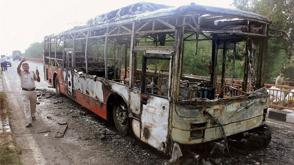 

 A DTC bus set on fire by followers of Dera Sacha Sauda chief Gurmeet Ram Rahim after his conviction in a rape case, in New Delhi.