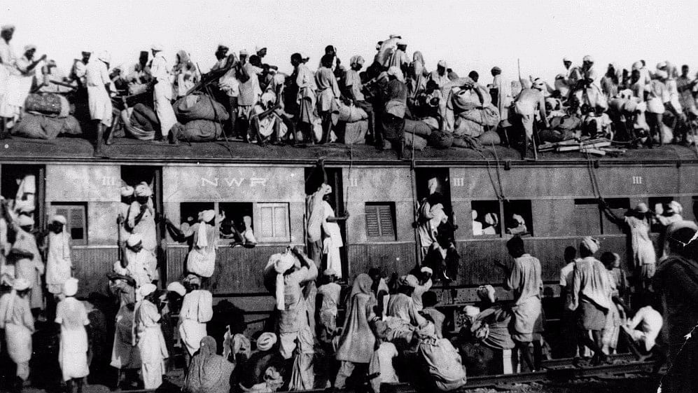 

In this September 1947 photo, hundreds of Muslim refugees are seen on top of a train leaving New Delhi for Pakistan. 