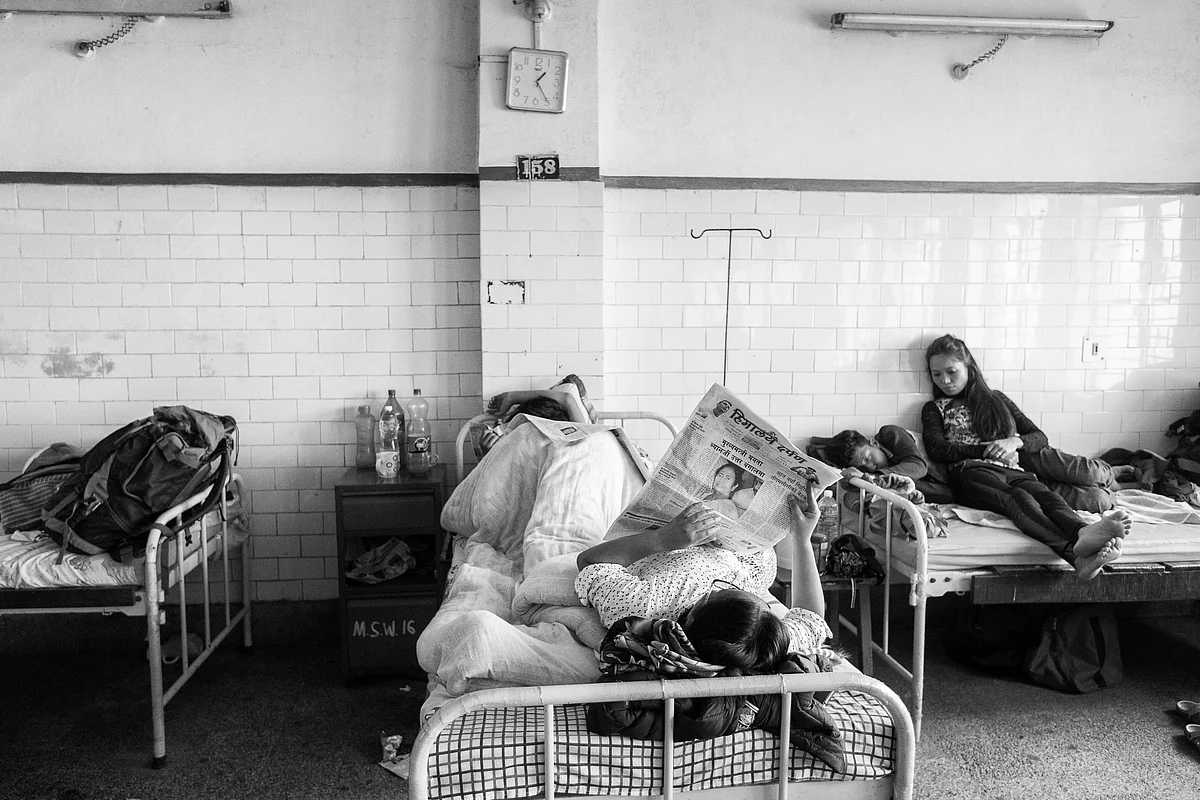 People read newspapers inside a government hospital in Darjeeling. After the ban on internet, locals depend on newspapers, mostly regional, for their source of news on the movement.