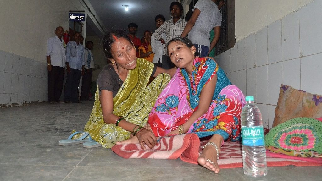 Family members and relatives mourn outside the  BRD Hospital in Gorakhpur where at least 30 children died since the past two days, allegedly due to oxygen supply cut on Friday.&nbsp;