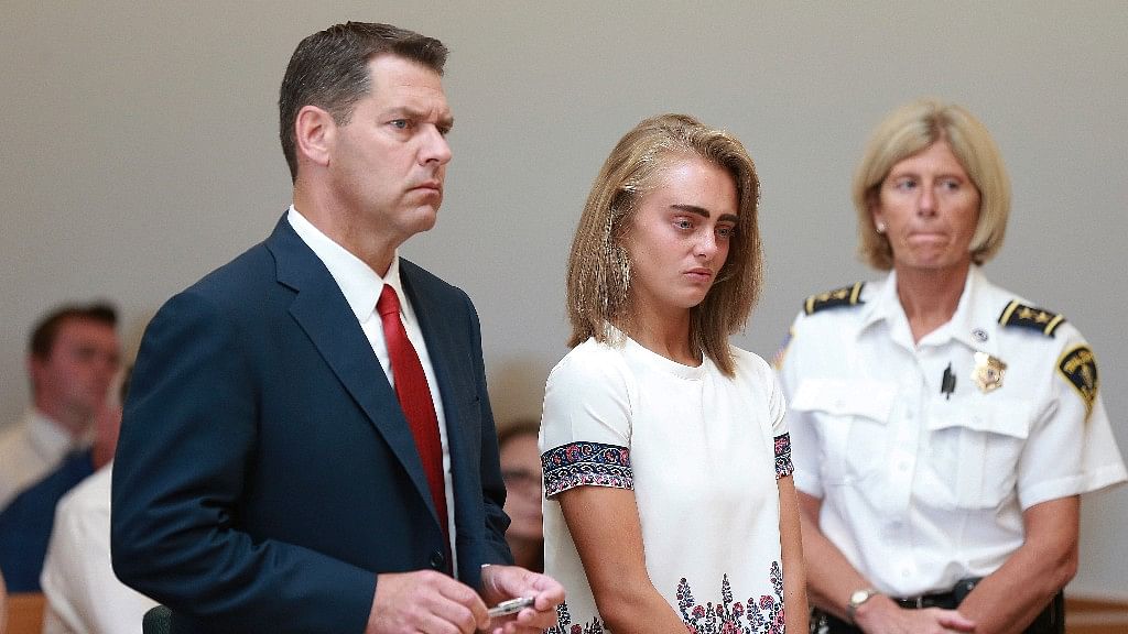 Michelle Carter (centre) listens to her sentencing for involuntary manslaughter for encouraging 18-year-old Conrad Roy III to kill himself in July 2014.