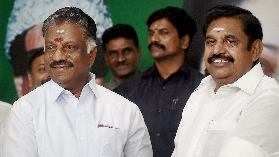 O Panneerselvam (L) and Tamil Nadu Chief Minister E Palaniswami exchange greetings.