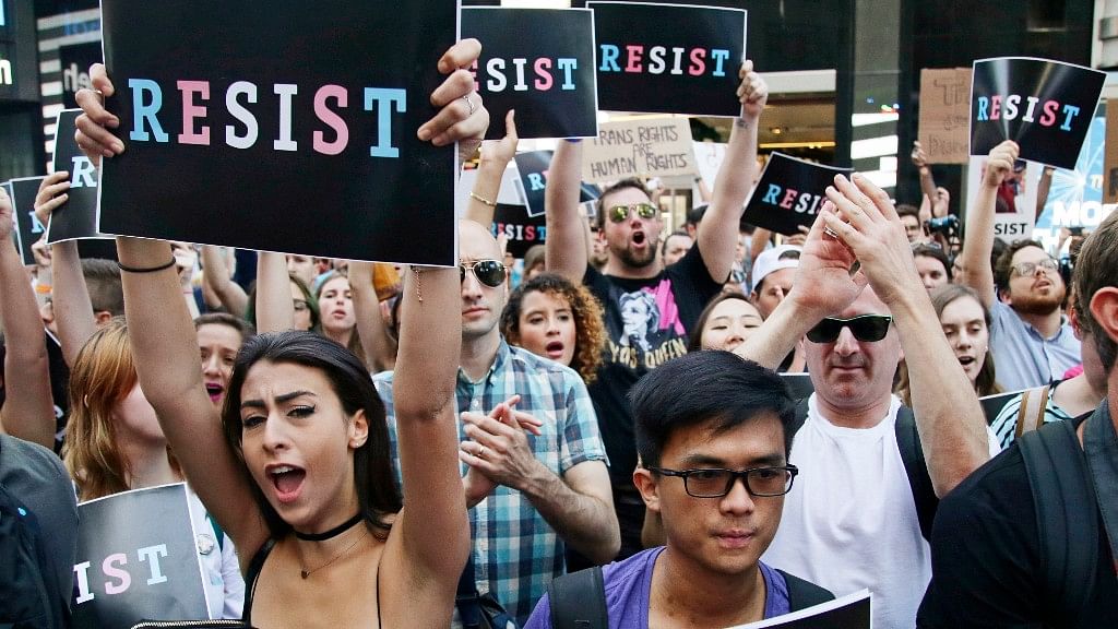 Protesters attend a rally in New York City to protest President Donald Trump’s announcement of a ban on transgender troops serving anywhere in the US military.&nbsp;
