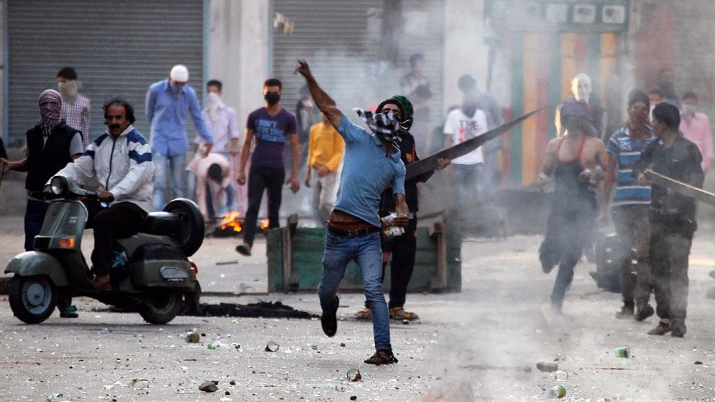 A Kashmiri protester throws a stone towards police during a strike called by separatist groups against the killings in south Kashmir. Image used for representation.