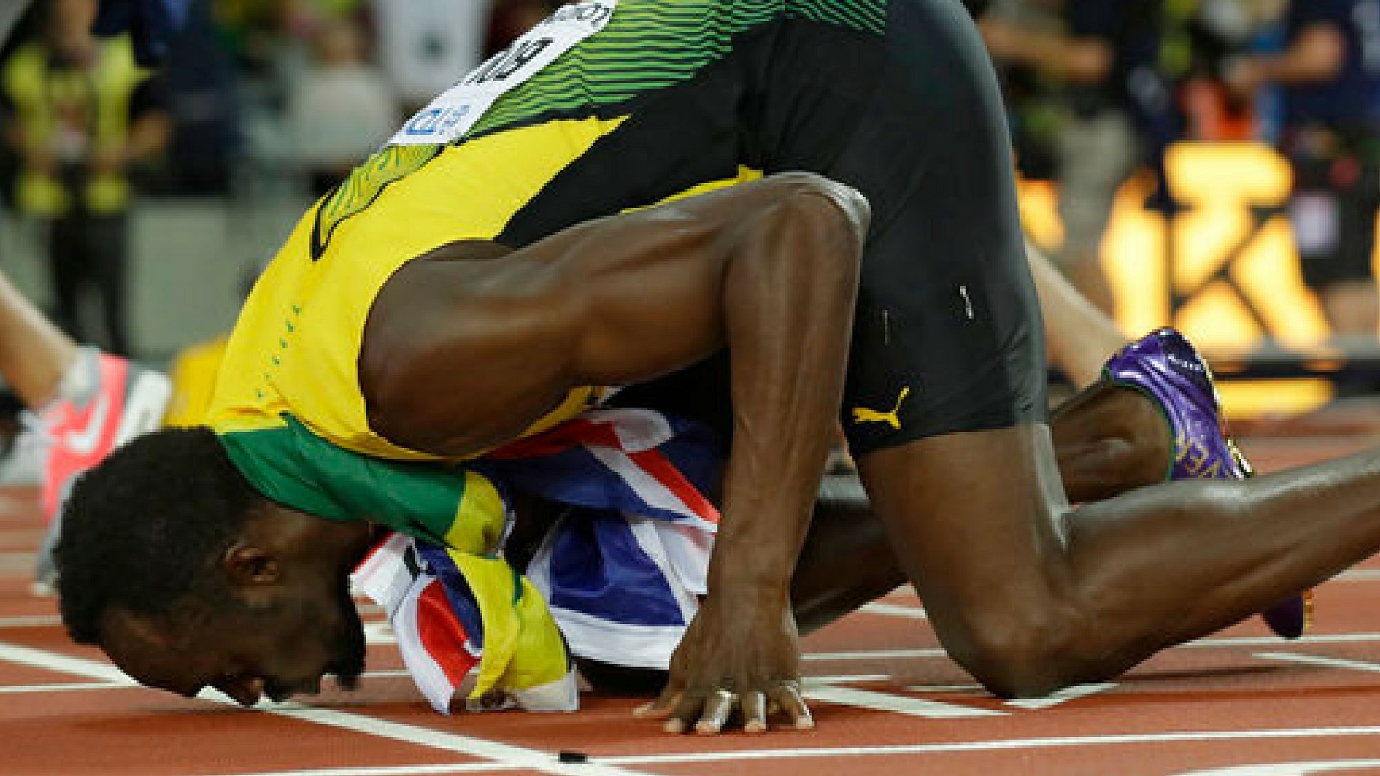  Jamaica’s Usain Bolt kisses the track after placing third in the men’s 100m final during the World Athletics Championships in London Saturday, Aug. 5, 2017.