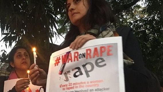 A candle march against rape cases