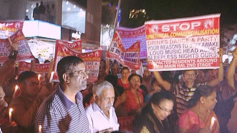 

Residents of Indiranagar have been holding silent, candlelight vigils outside illegal commercial establishments, on every weekend for the past four months.