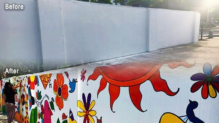 Armed with paint brushes, volunteers unleashed their creativity on a drab-looking wall.&nbsp;
