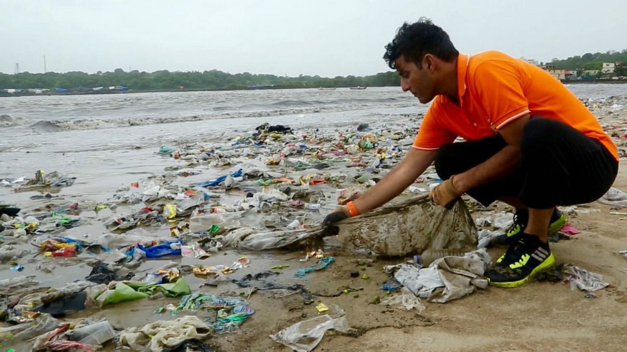 File photo of Afroz Shah at Versova beach doing what he does best.&nbsp;