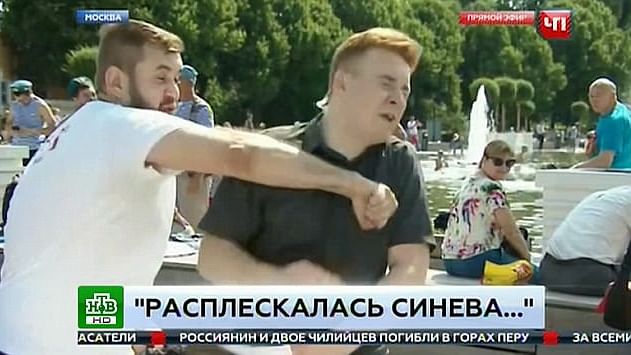 Russian TV Reporter Punched in The Face During Live Reporting