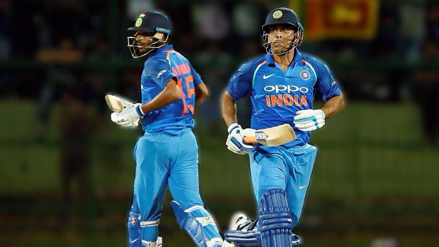 Bhuvneshwar Kumar and MS Dhoni take a single during the second ODI against Sri Lanka.