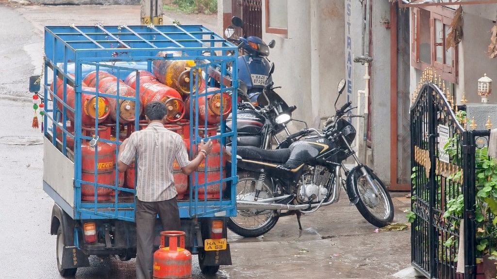 

An employee of a petroleum company delivers an LPG cylinder at a home in Bengaluru.&nbsp;