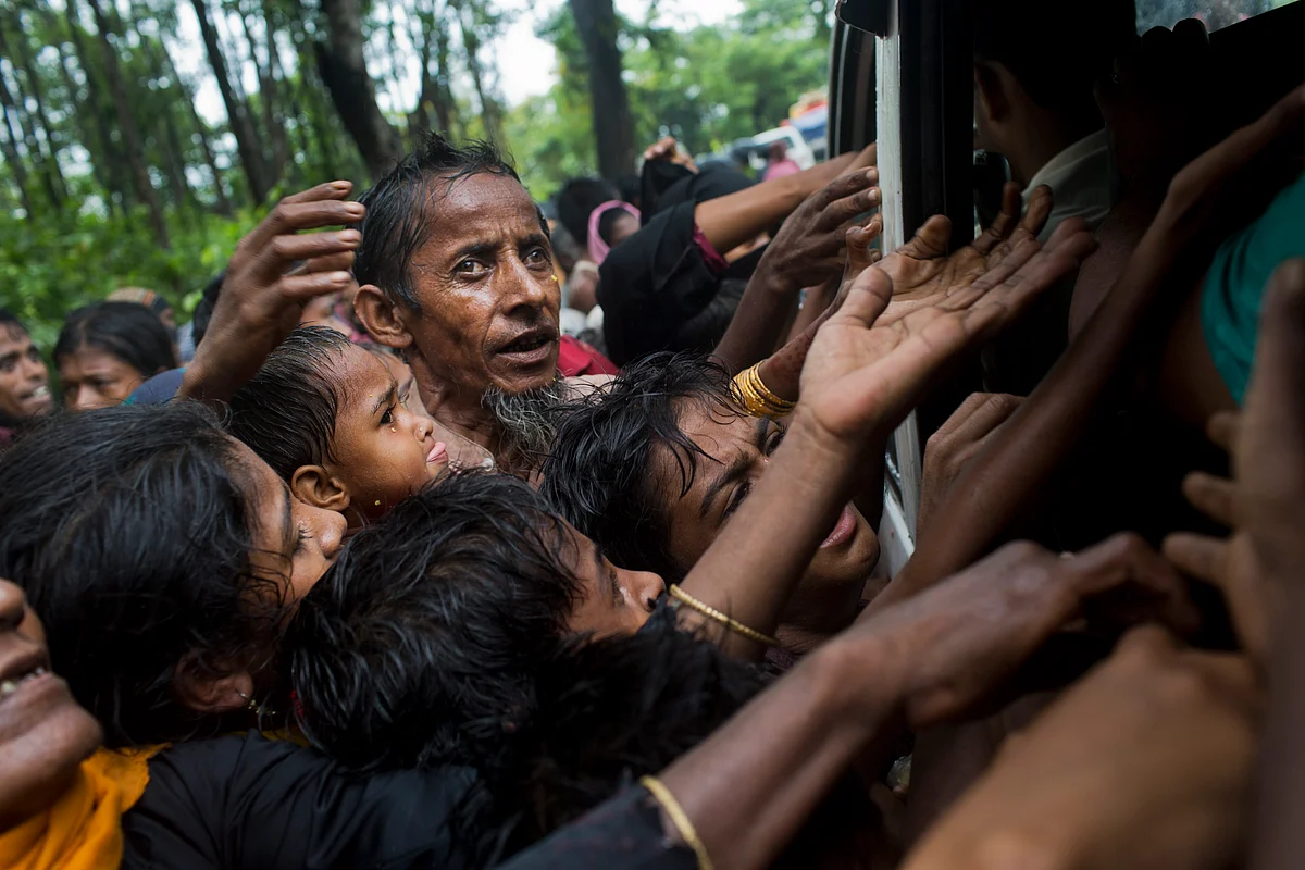 Rohingya scuffle to get aid material from local volunteers at Kutupalong, Bangladesh.