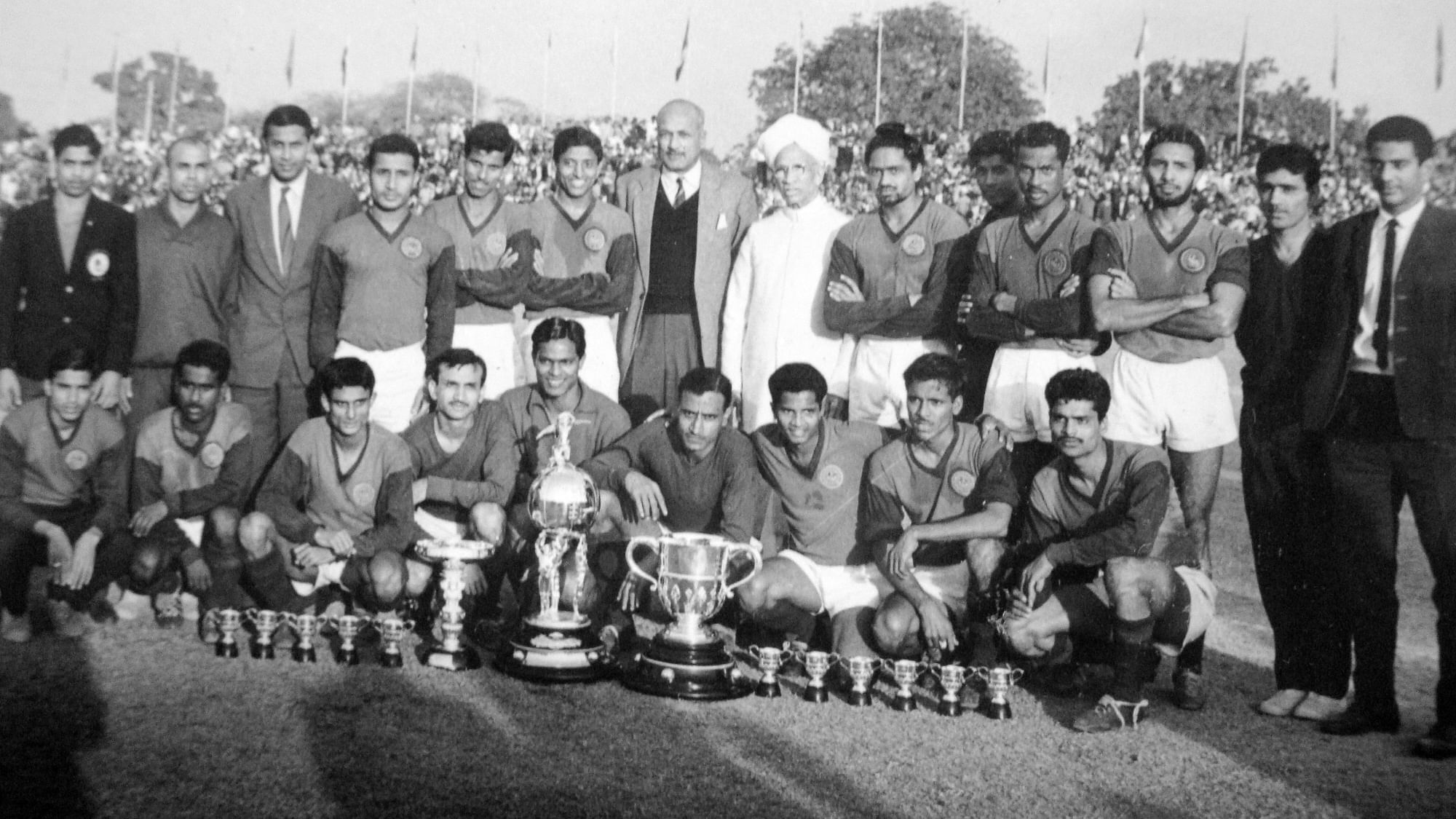 The 1965 Mohun Bagan squad that won the Durand for the third successive year—the first Indian club to do so—with President Dr S. Radhakrishnan. Standing sixth from left is Chuni Goswami, ninth is Jarnail Singh; kneeling third from right is Arumainayagam, next is Prodyut Burman, and seventh is Ashok Chatterjee.&nbsp;
