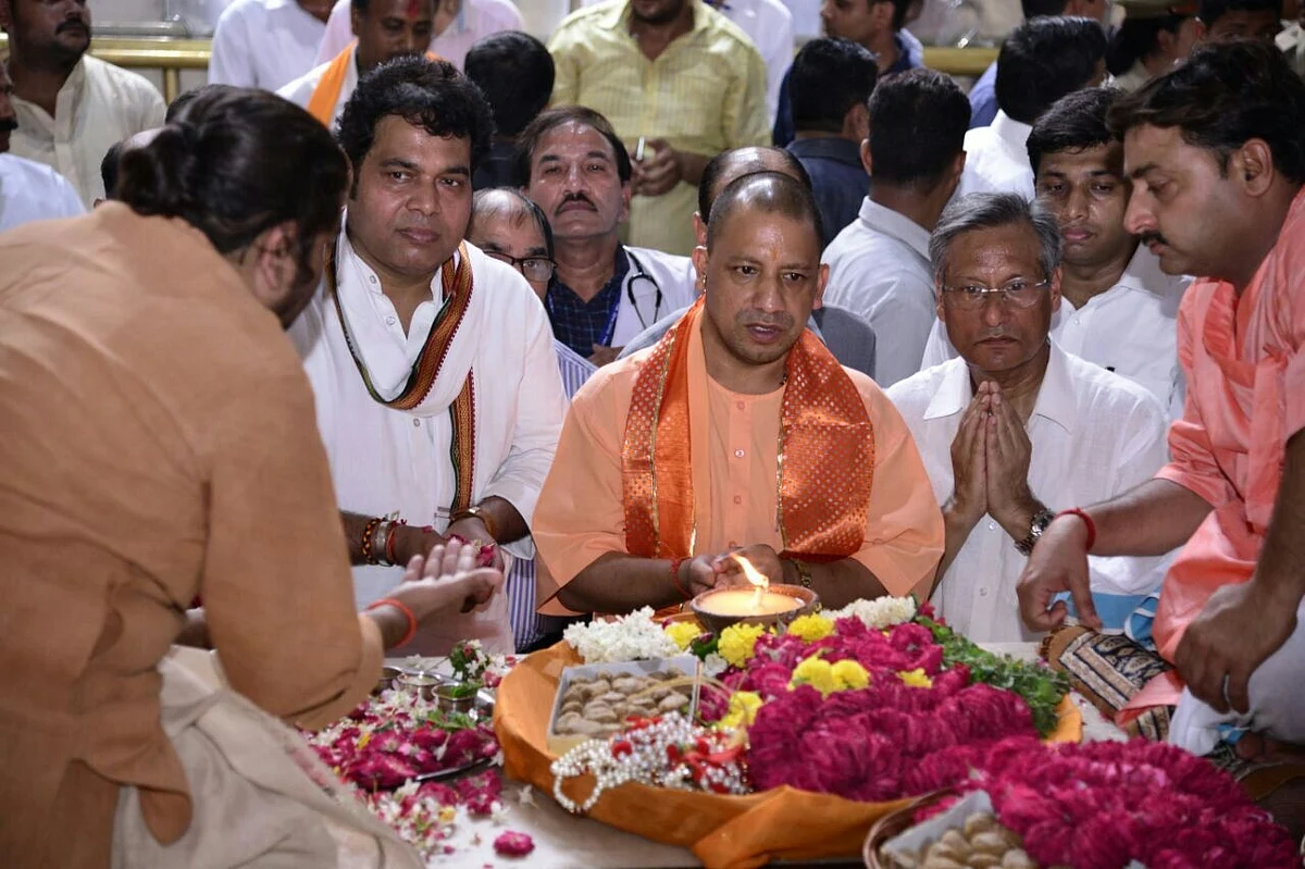 UP Chief Minister Yogi Adityanath along with UP Power Minister Shrikant Sharma during their visit to Bankey Bihari temple in Vrindavan, on 19 September 2017.