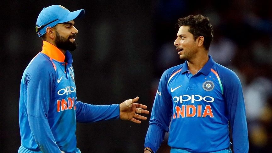Virat Kohli and Kuldeep Yadav share a moment during an ODI.