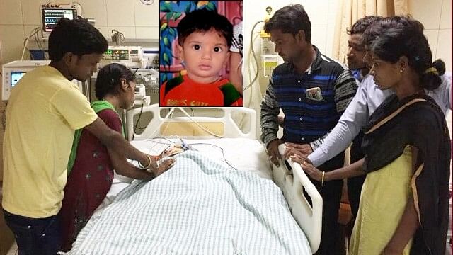 14-month-old Somnath lying on the hospital bed.