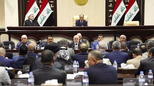 Iraqi Prime Minister Haider al-Abadi, center, attends a session of the Iraqi Parliament