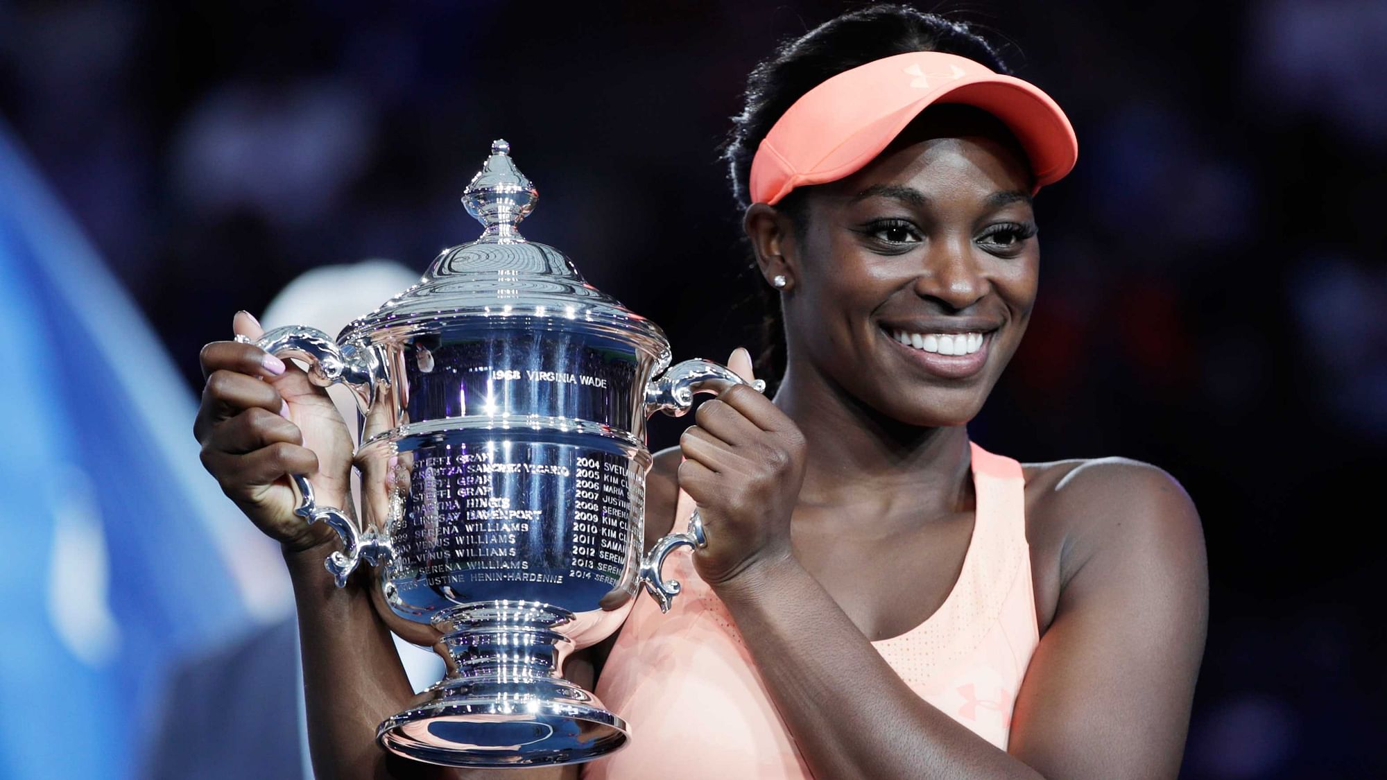 Sloane Stephens, of the United States, holds up the championship trophy after beating Madison Keys, of the United States, in the women’s singles final of the U.S. Open