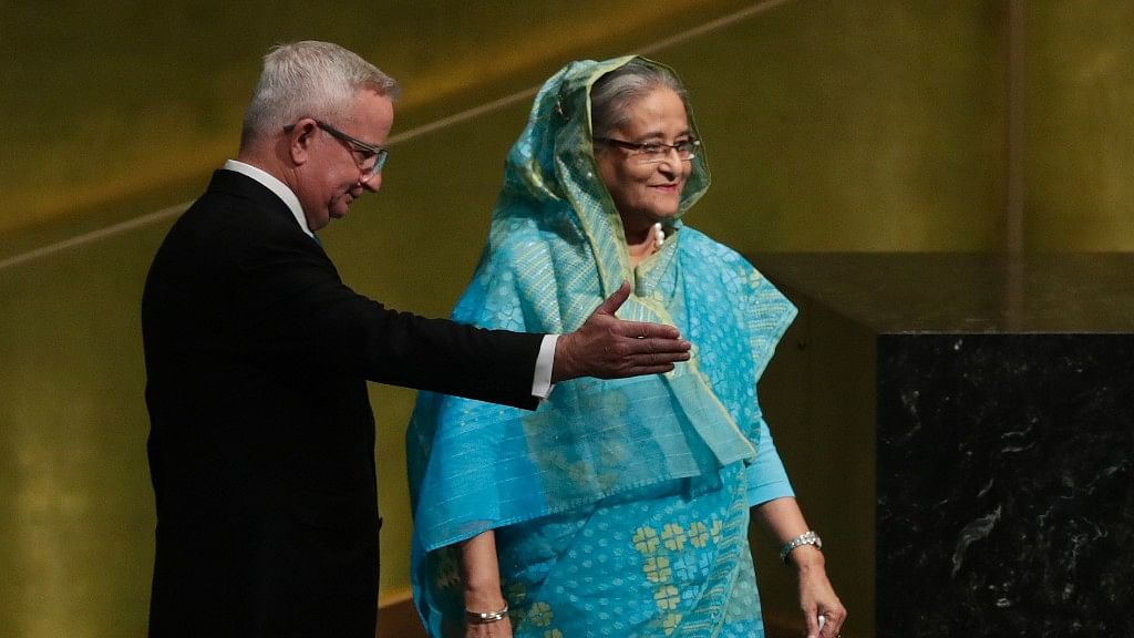 

Bangladesh Prime Minister Sheikh Hasina is escorted to the podium to address the United Nations General Assembly on 21 September.