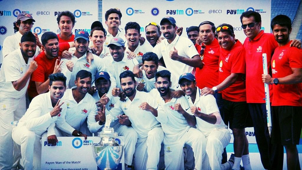 The Mumbai team pose with the Ranji Trophy in February 2016.