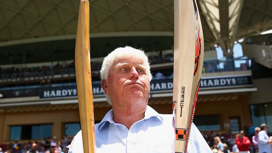 Barry Richards holds his bat, with which he scored 325 in a day at the WACA in 1970 in his right hand, and David Warner’s bat in his left.