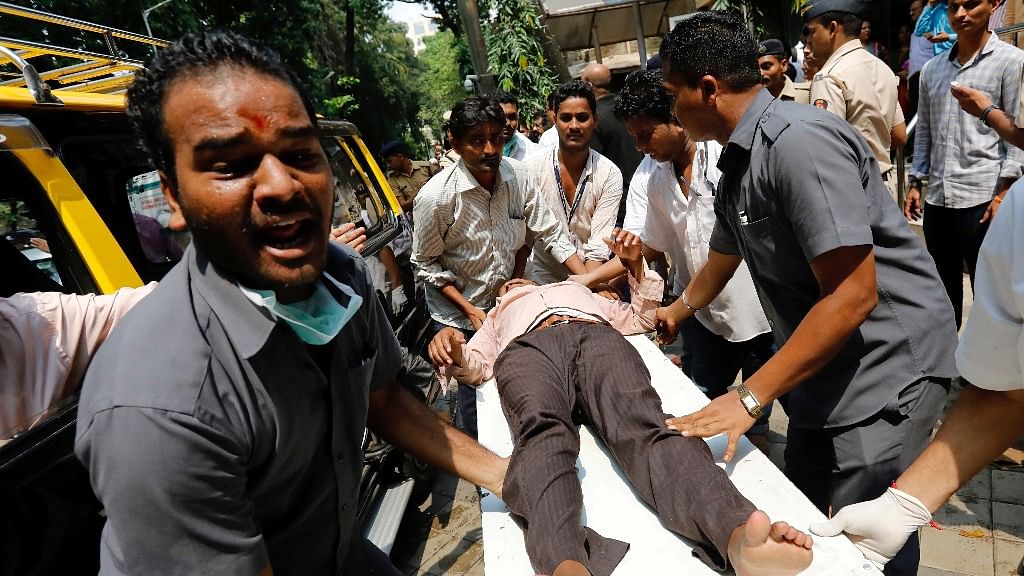 Mumbaikars rush the injured to hospital.